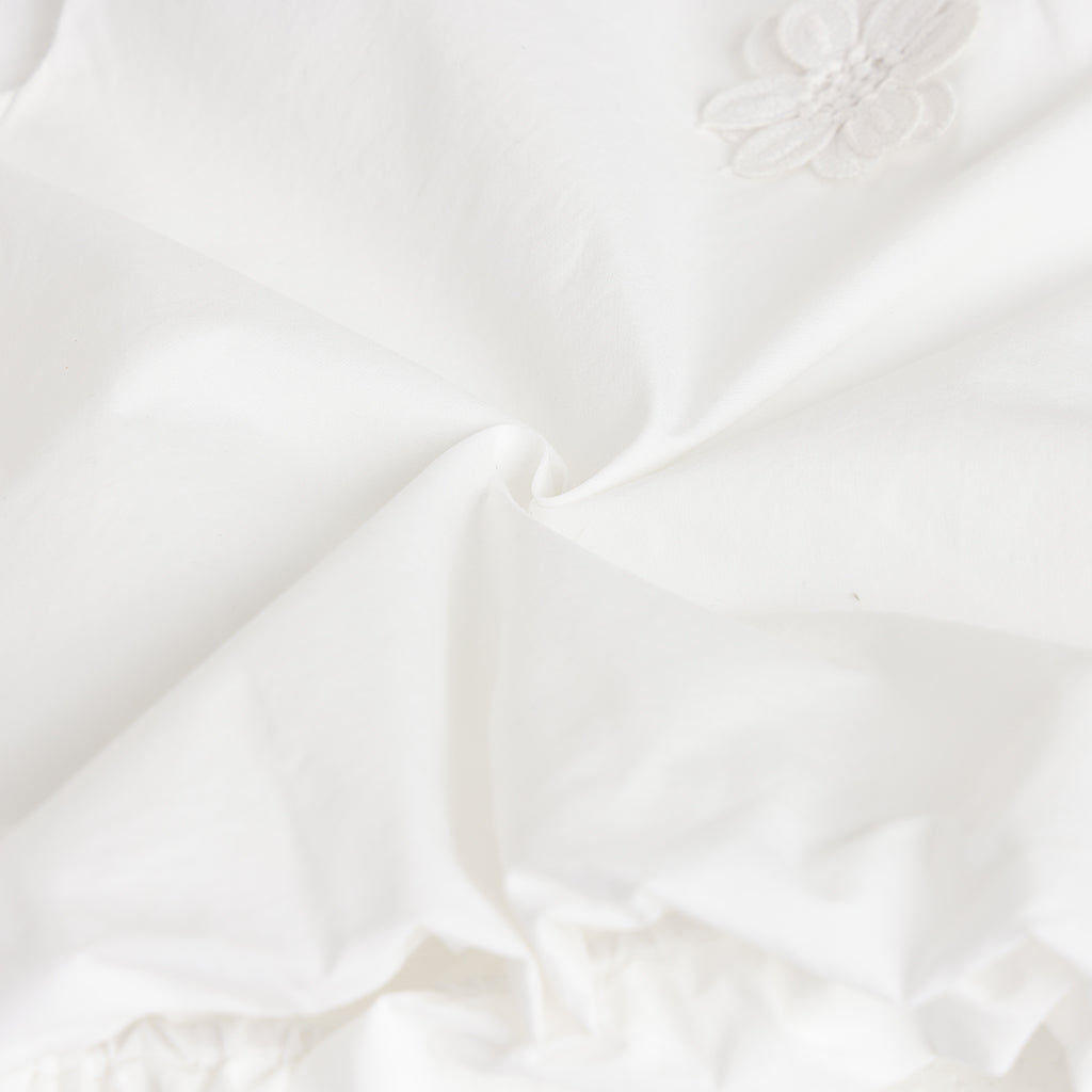 Close-up of white fabric with subtle texture
