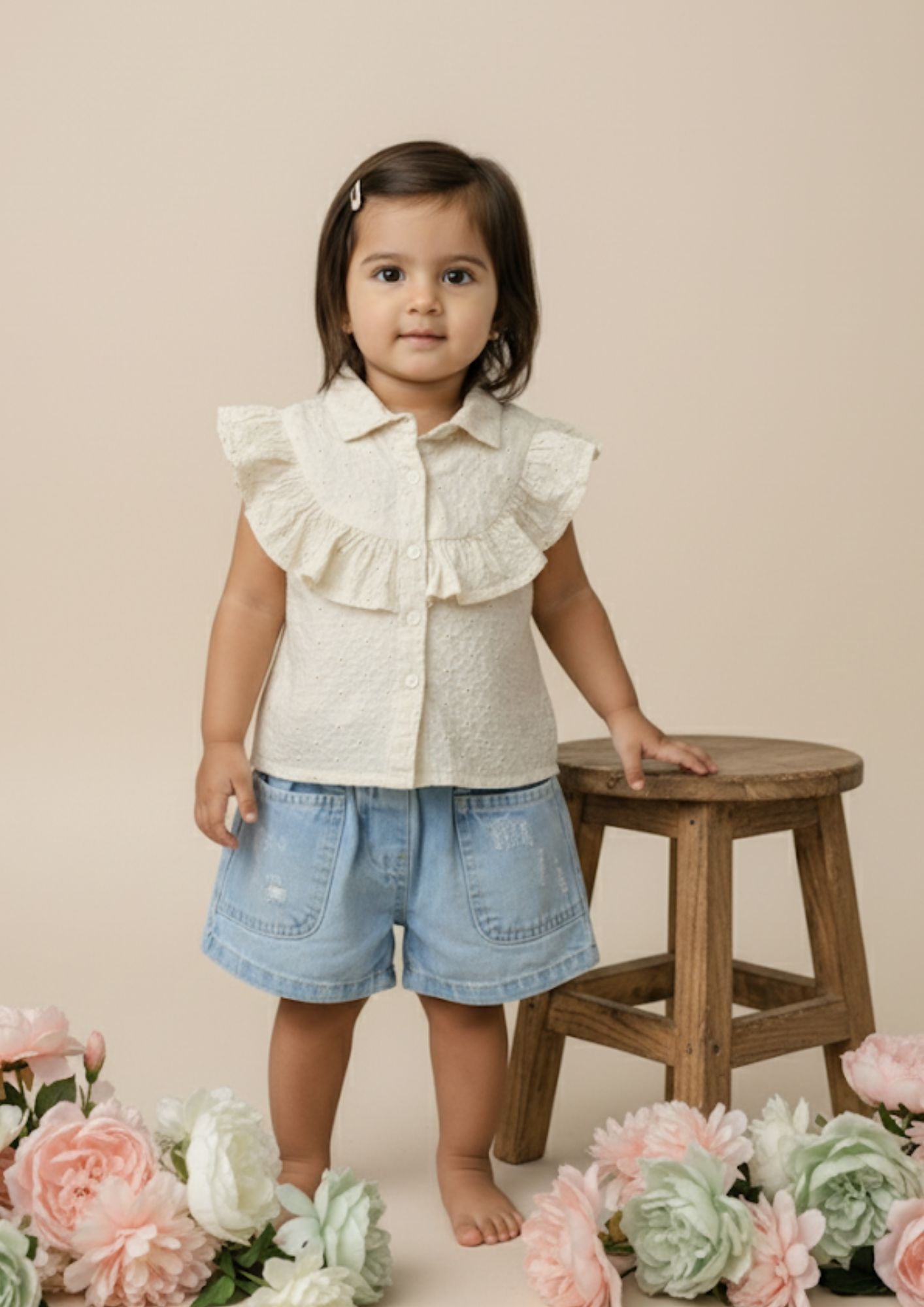 Cream Sleeveless Accoba Top and Light Blue Denim Torn Shorts