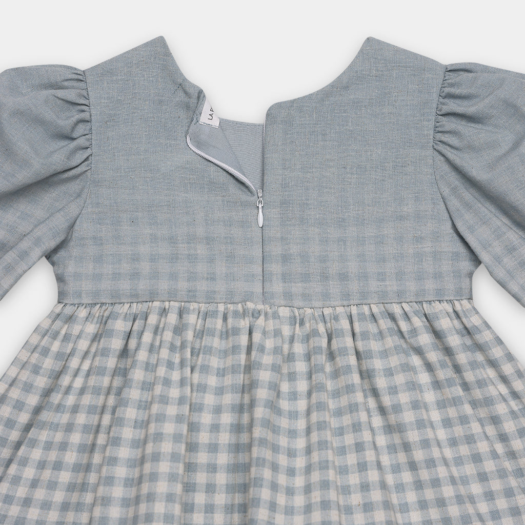 Gray checkered dress with long sleeves on a white background