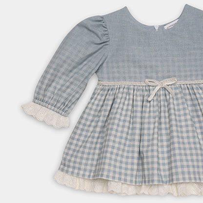 Blue checkered dress with lace trim on a white background