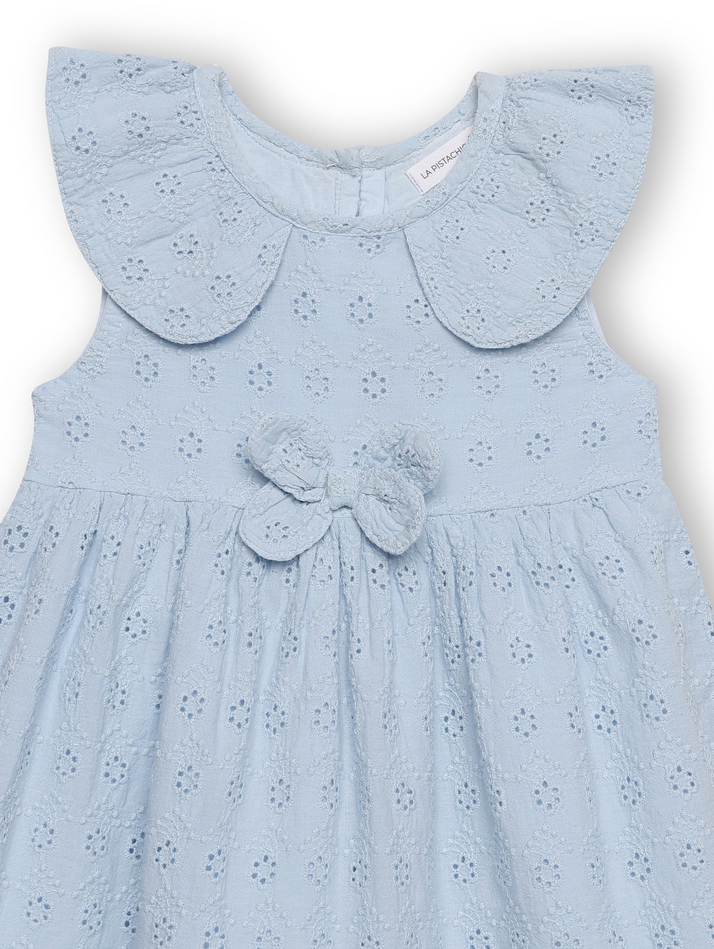 Light blue dress with a butterfly detail on a white background
