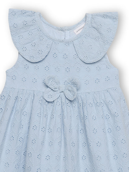 Light blue dress with a butterfly detail on a white background