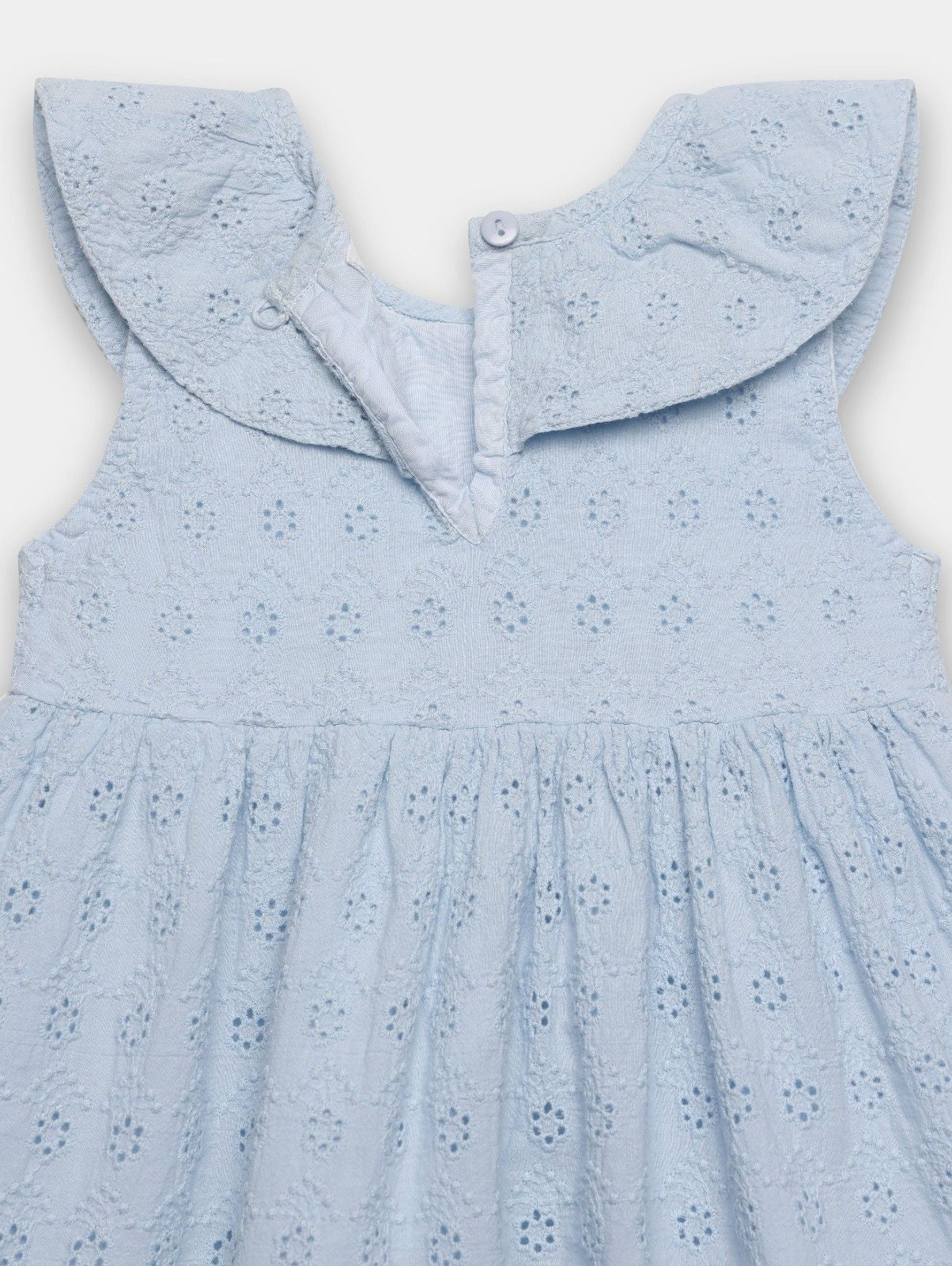 Light blue dress with a ruffled collar on a white background