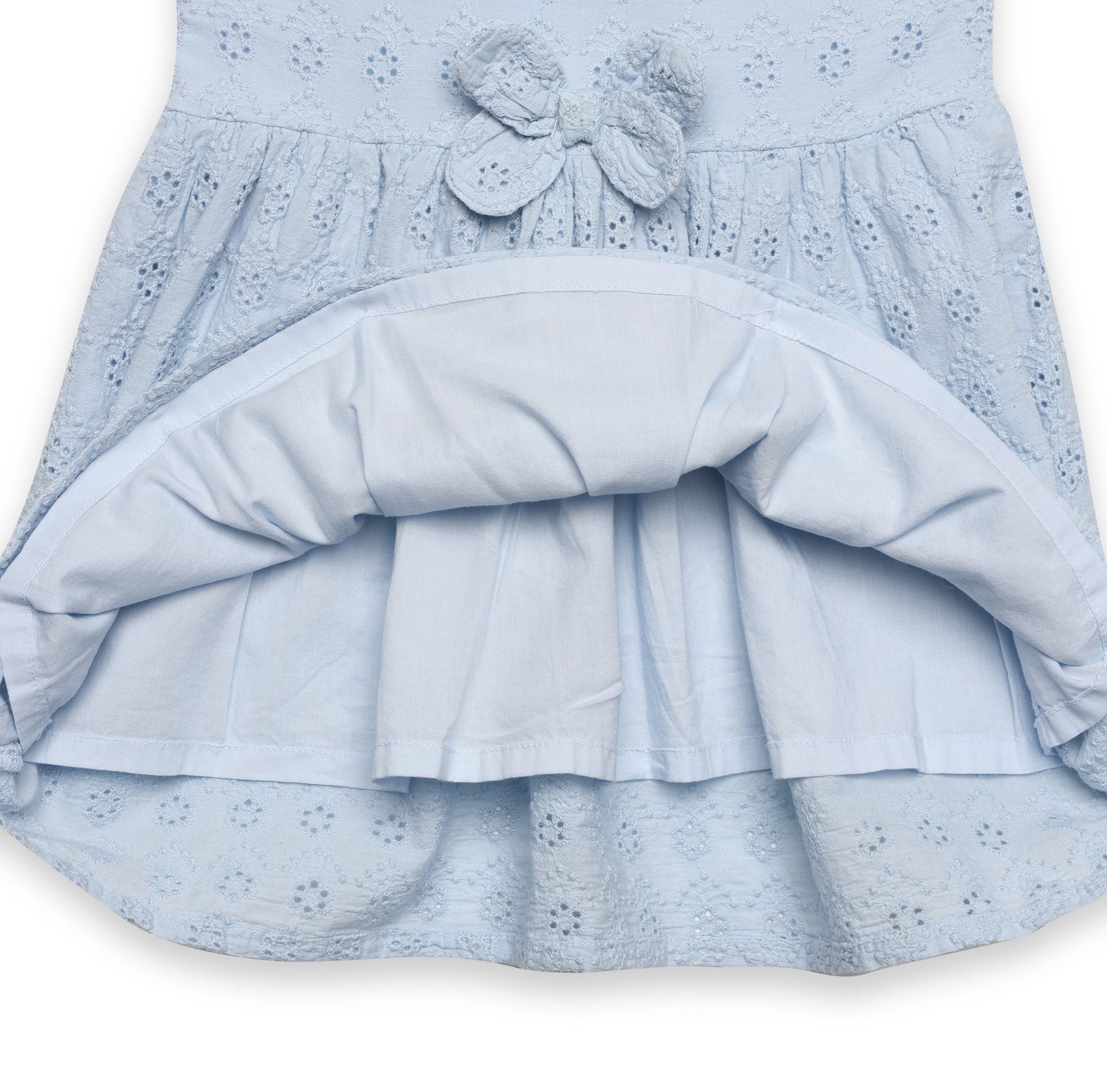 Light blue dress with a bow detail on a white background