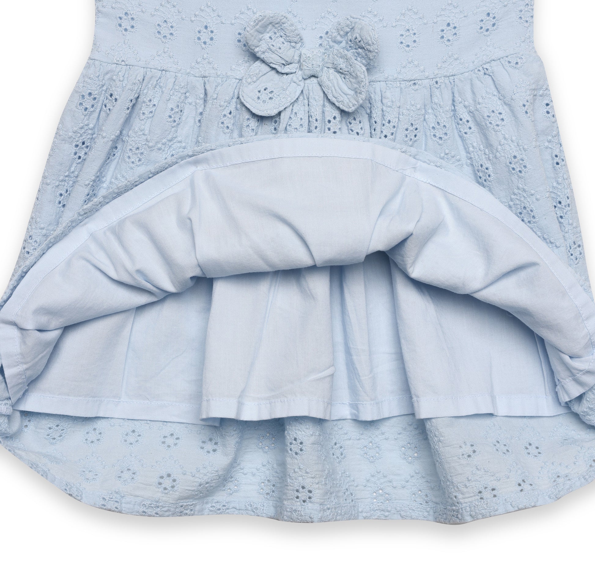 Light blue dress with a bow detail on a white background