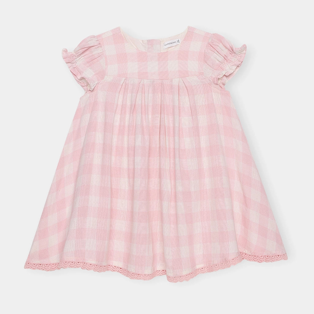 Pink dress with ruffled sleeves on a white background