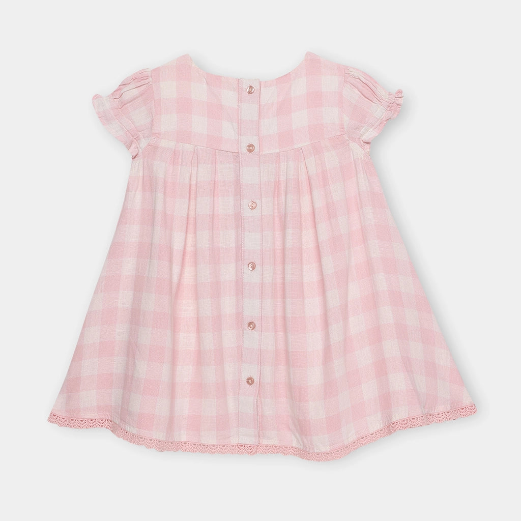 Pink checkered dress on a light gray background