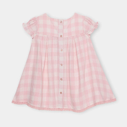 Pink checkered dress on a light gray background