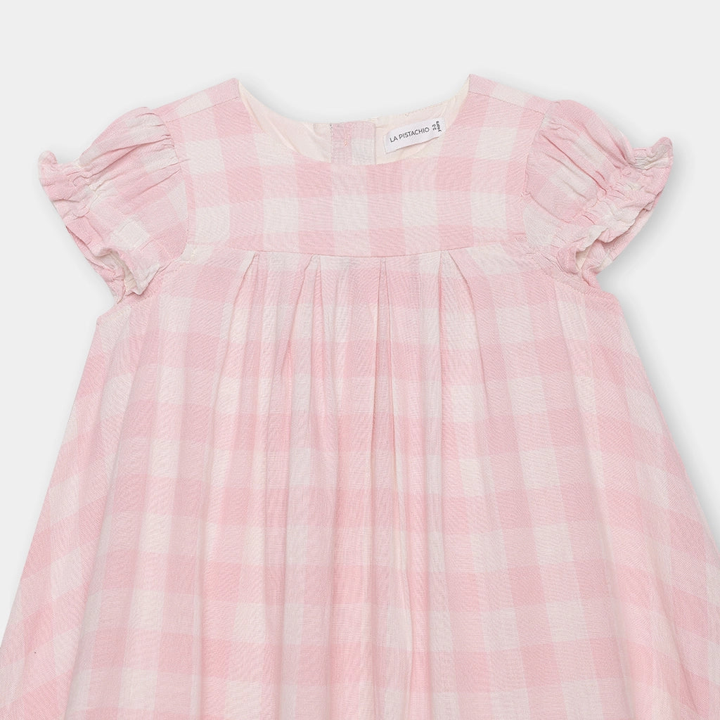 Pink and white checkered dress on a light gray background