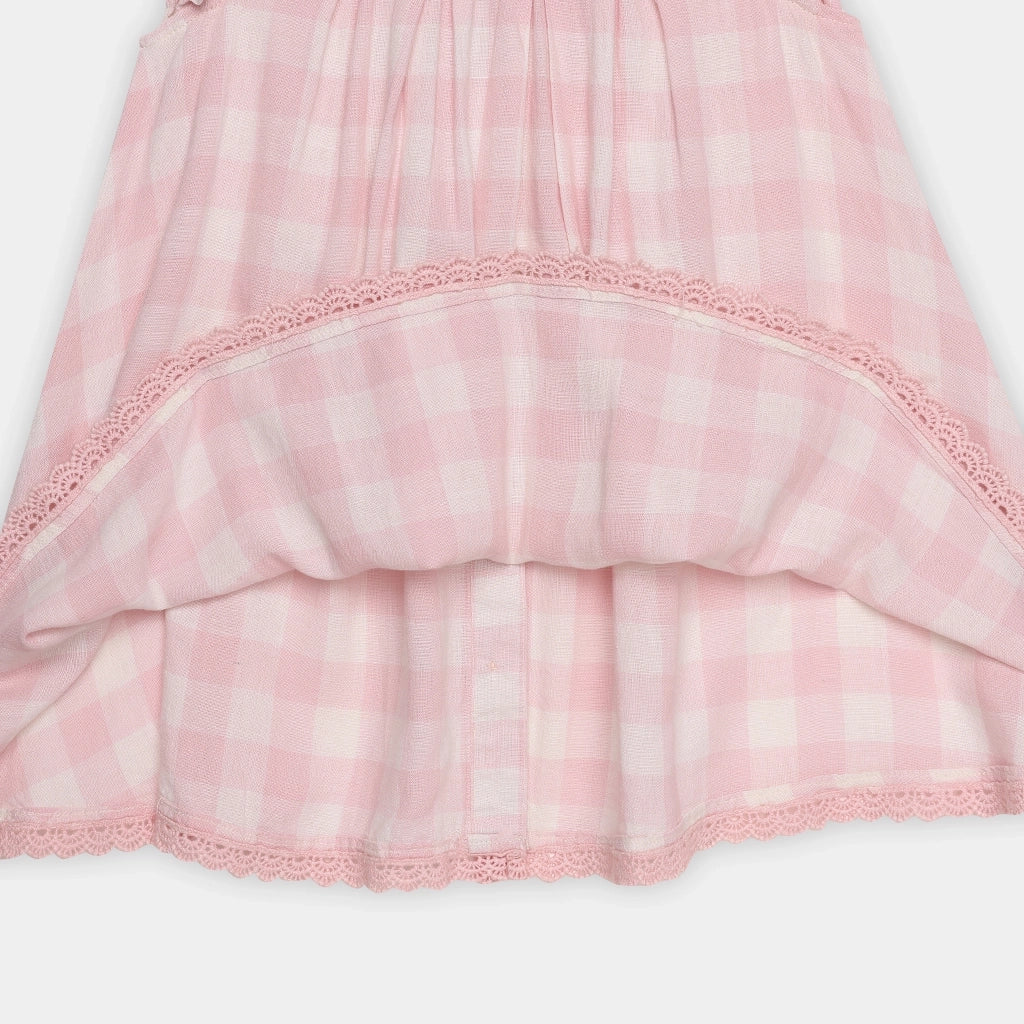 Pink lace-trimmed fabric on a white background