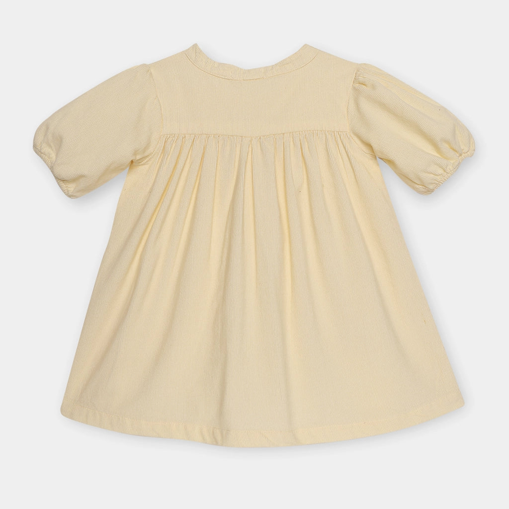 Beige dress with puff sleeves on a white background