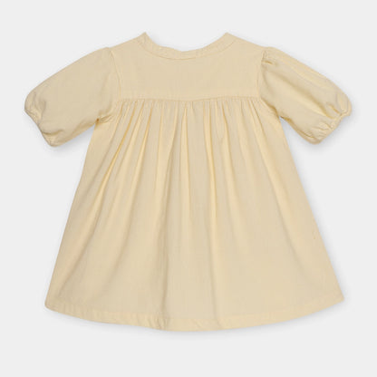 Beige dress with puff sleeves on a white background