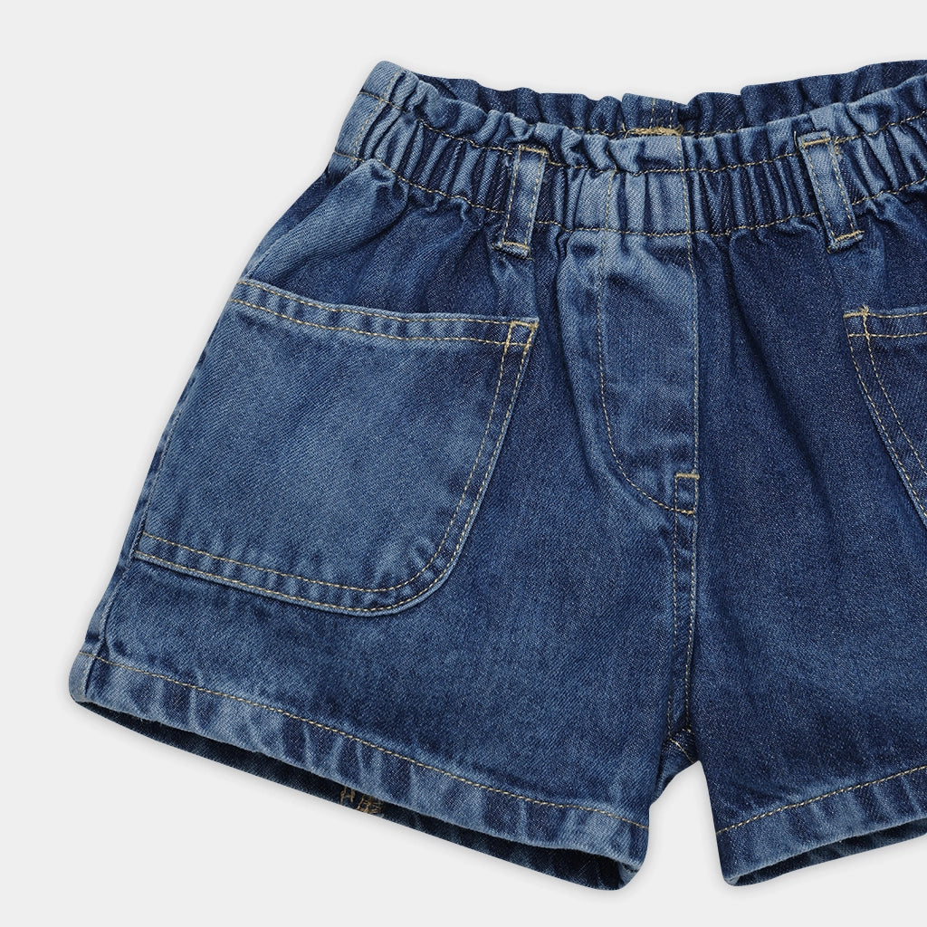 Blue denim shorts on a white background