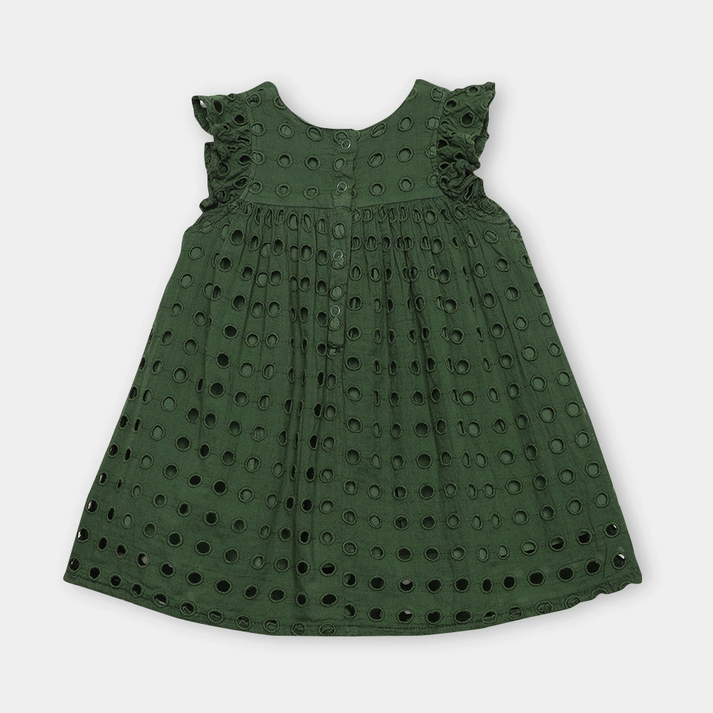 Green dress with eyelet details on a white background