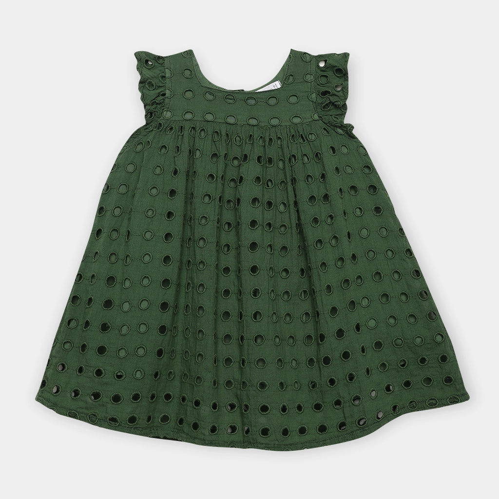 Green dress with cut-out pattern on a white background
