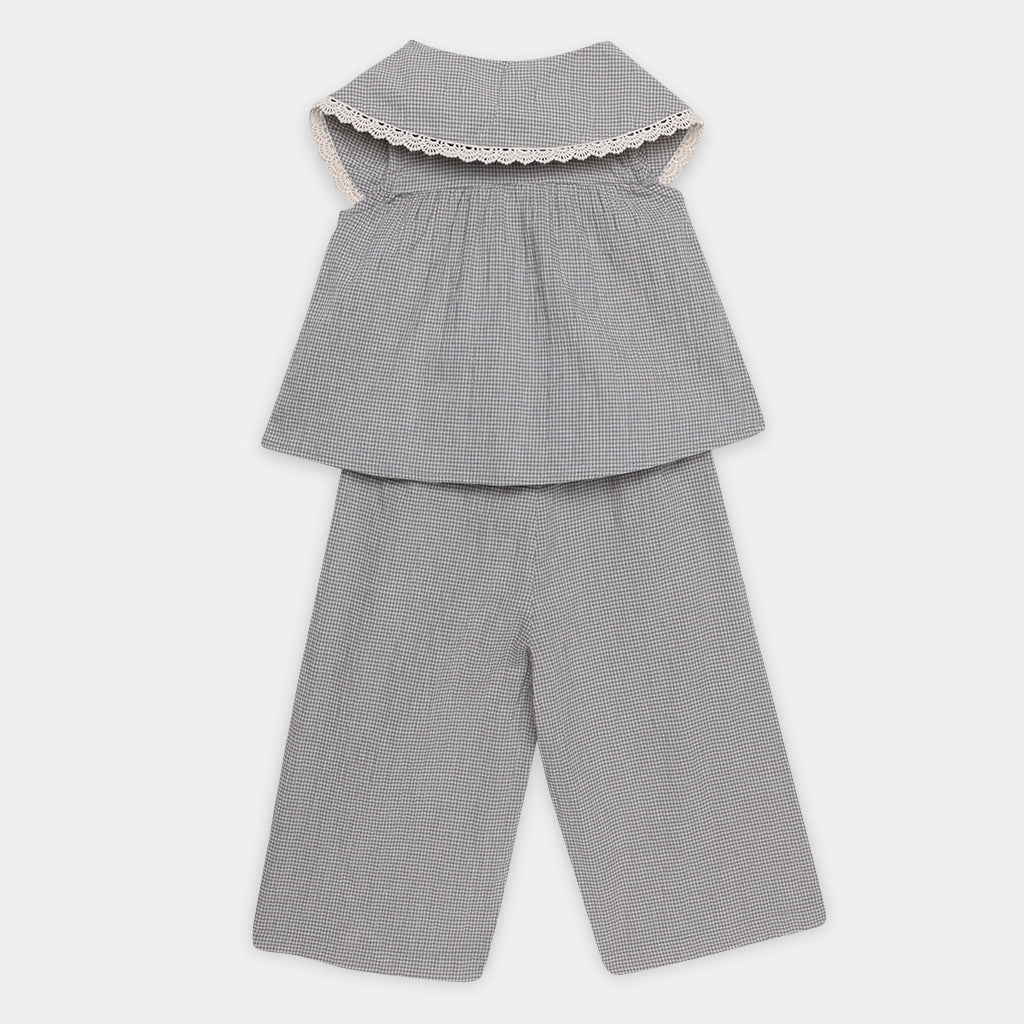 Gray checkered top and pants set on a white background