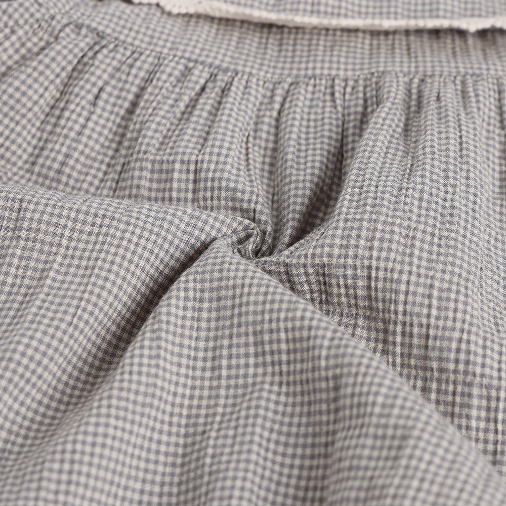 Close-up of gray checkered fabric with a soft texture