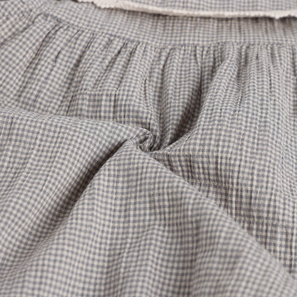 Close-up of gray checkered fabric with a soft texture