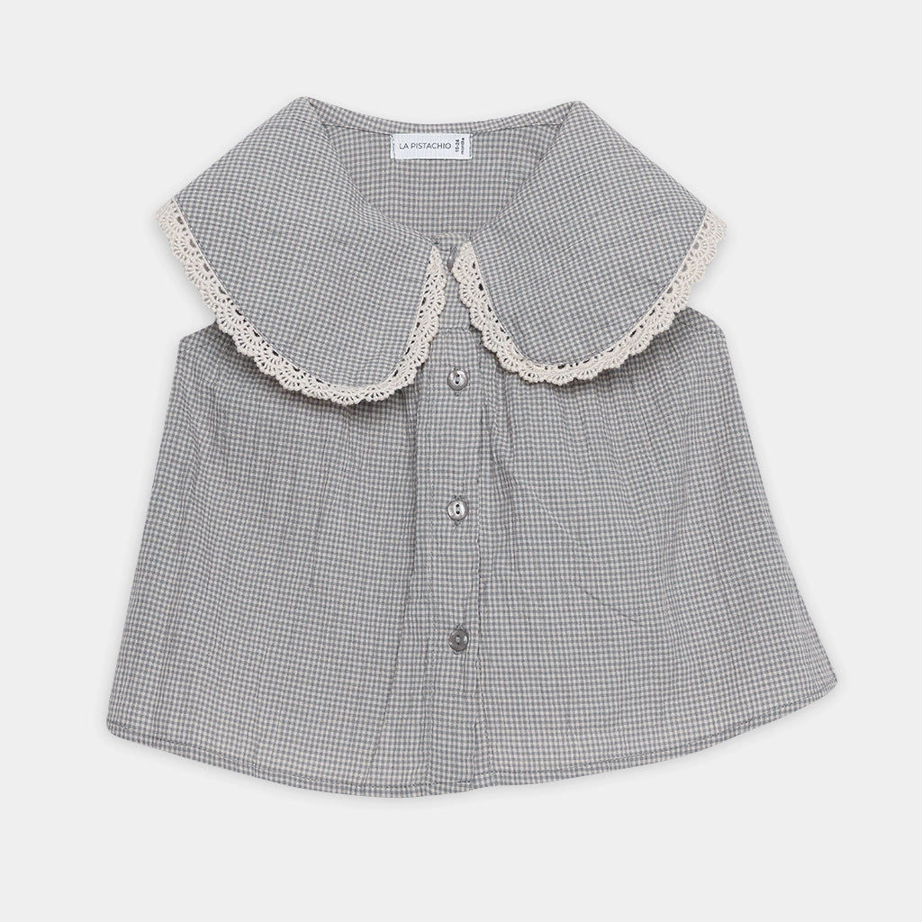 Gray checkered blouse with lace collar on a light gray background