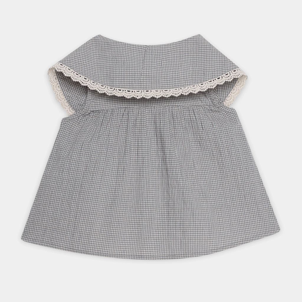 Gray checkered dress with lace trim on a white background