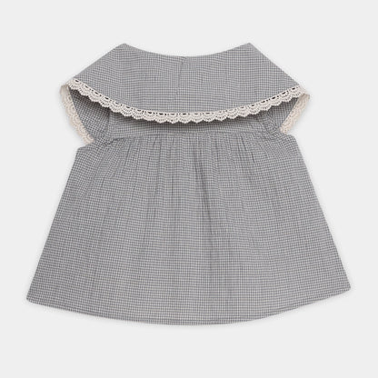 Gray checkered dress with lace trim on a white background