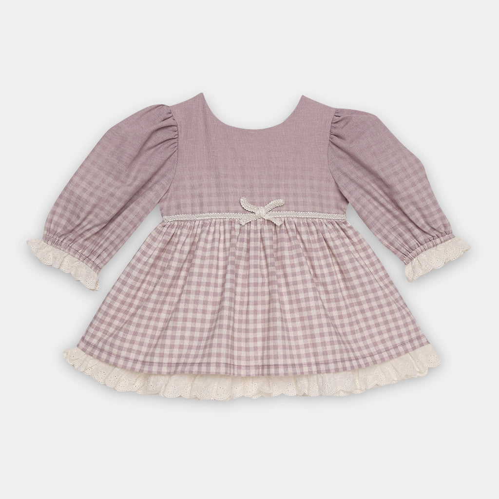 Pink checkered dress with long sleeves on a light gray background