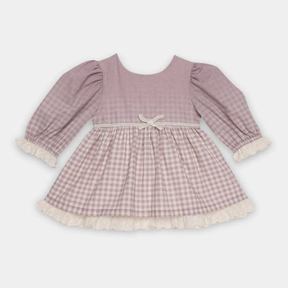 Pink checkered dress with long sleeves on a light gray background