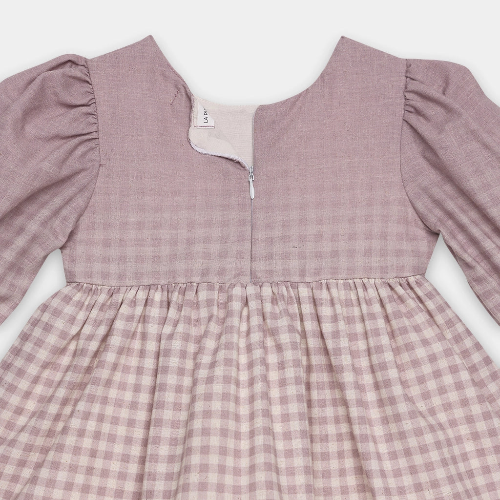 Pink checkered dress with long sleeves on a white background