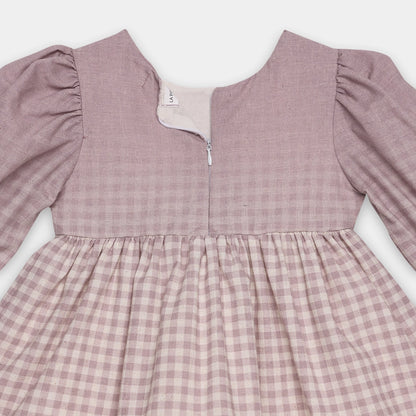 Pink checkered dress with long sleeves on a white background
