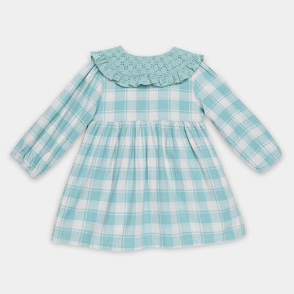 Children's dress with blue and white check pattern on a light gray background