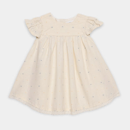 Beige dress with small patterns on a white background