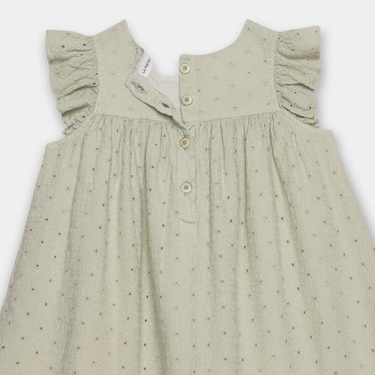 Green dress with ruffled shoulders on a white background