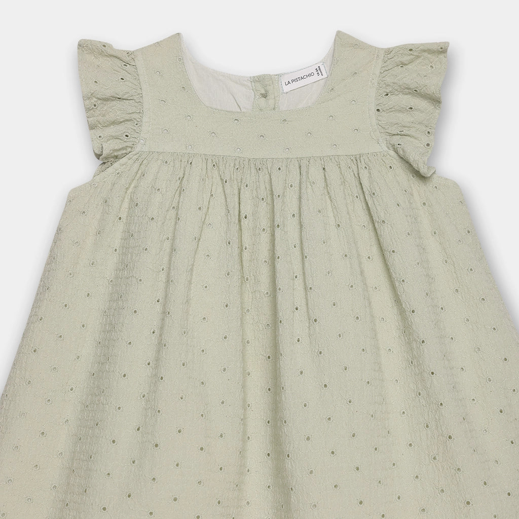 Light green dress with ruffled sleeves on a white background