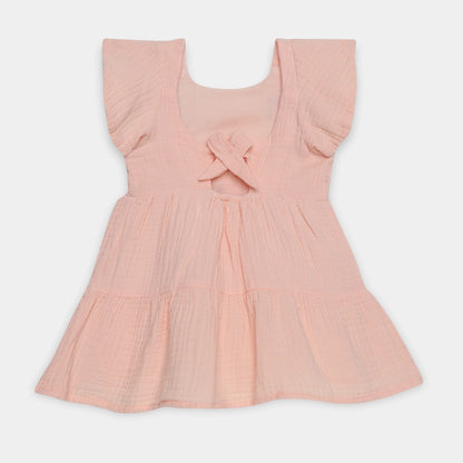 Pink dress with ruffled sleeves on a white background