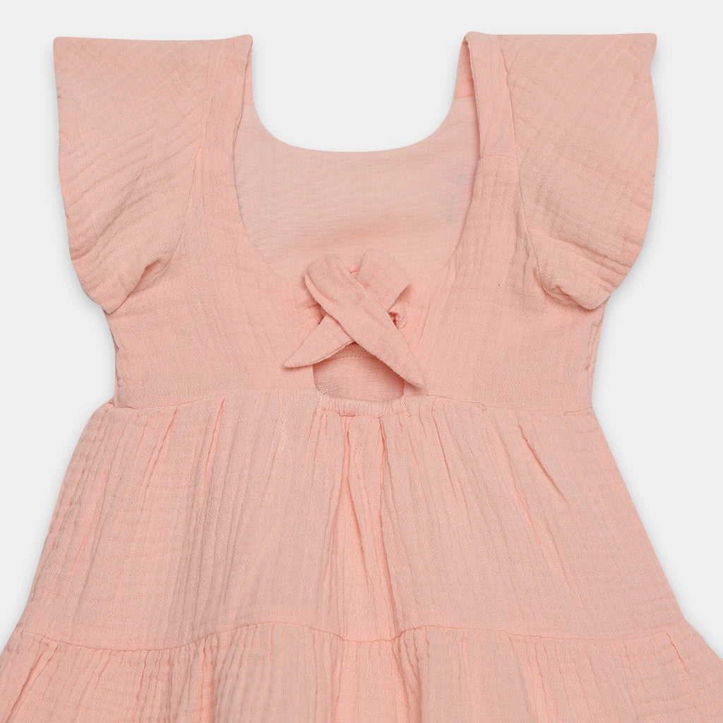 Pink dress with ruffled sleeves on a white background