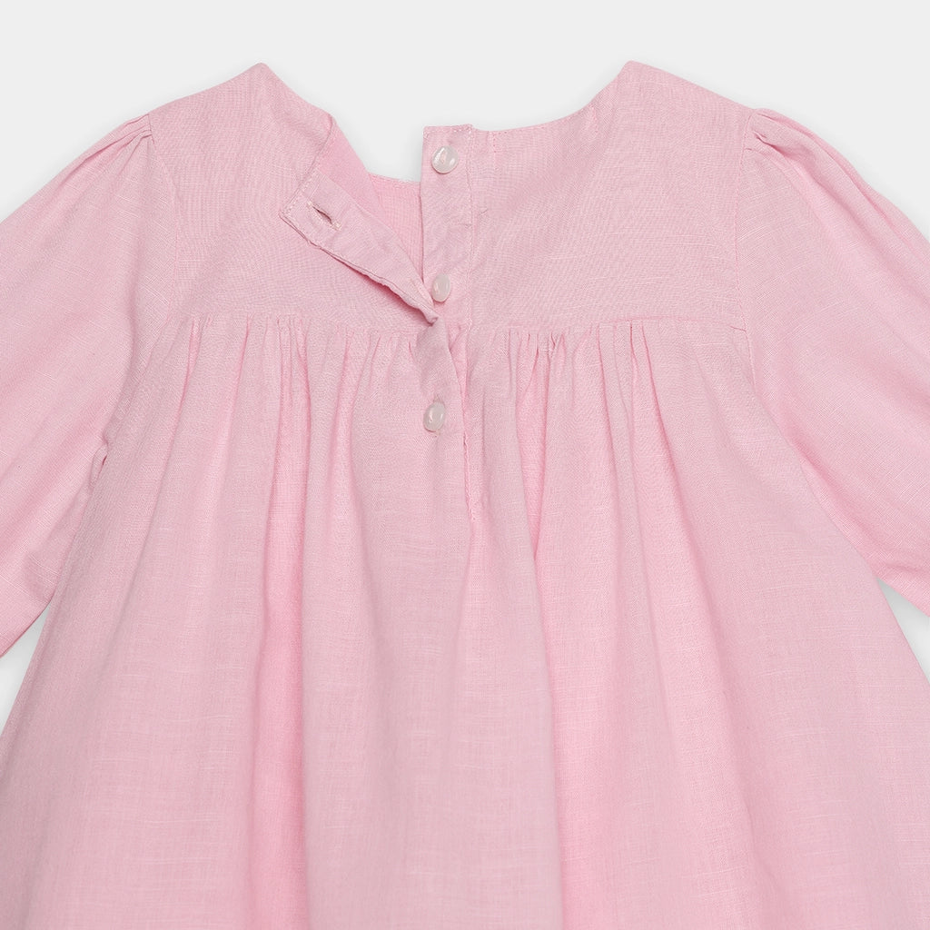 Pink dress with long sleeves on a white background