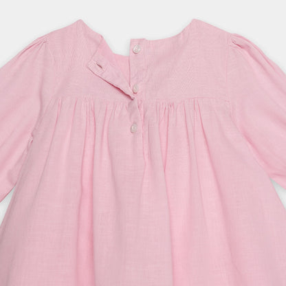 Pink dress with long sleeves on a white background