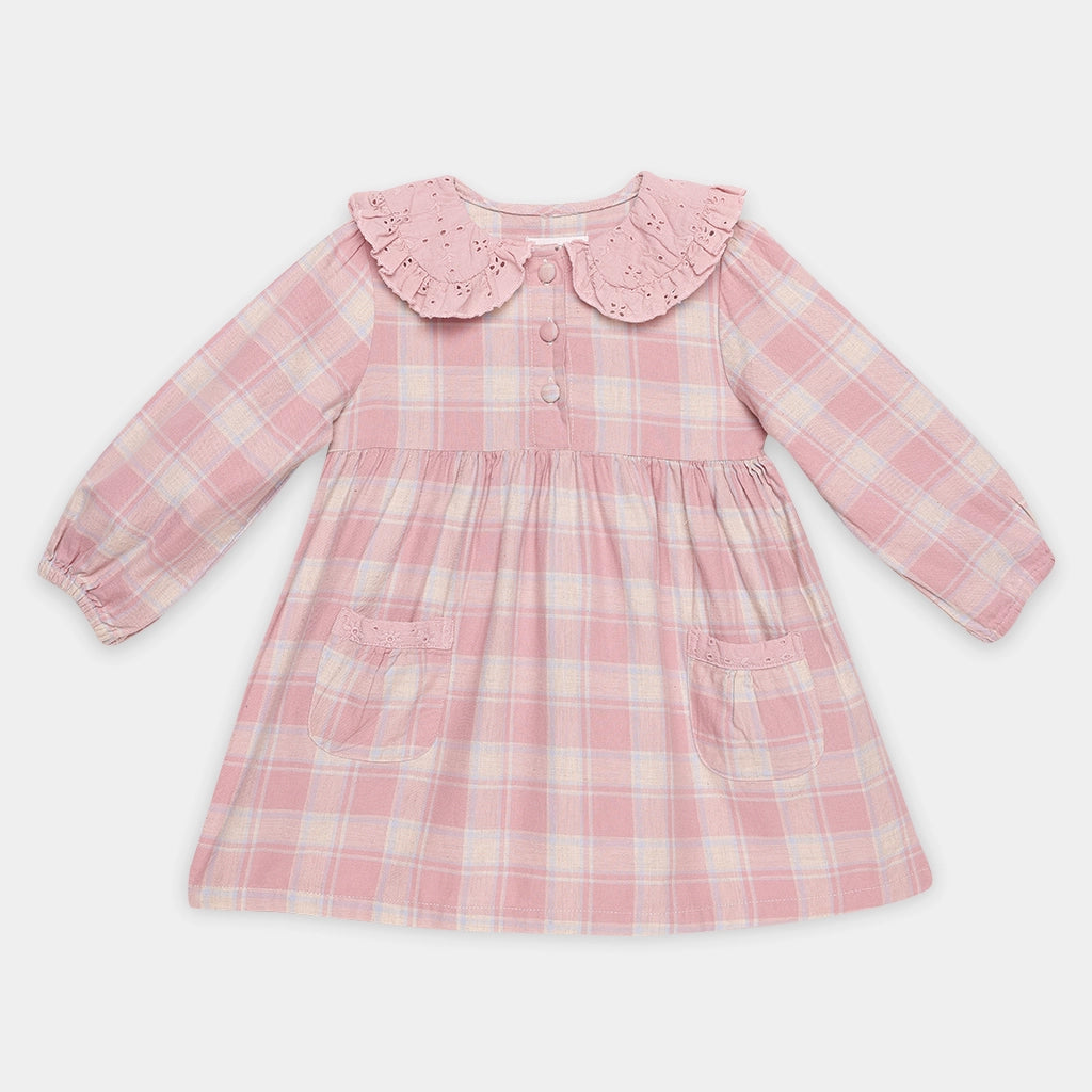 Pink plaid dress with a ruffled collar on a white background