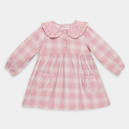 Pink plaid dress with a ruffled collar on a white background
