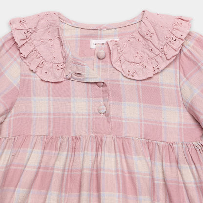 Pink plaid dress with lace collar on a white background
