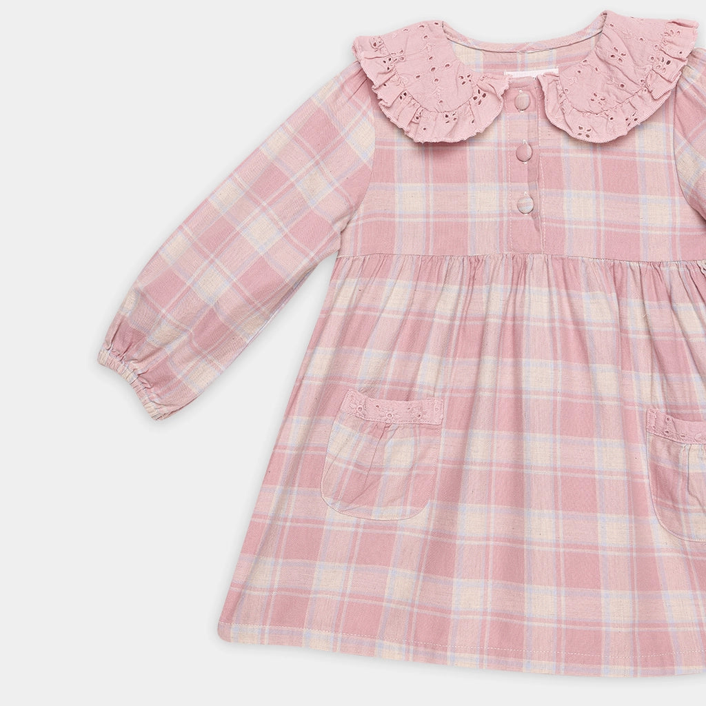 Pink plaid dress with a ruffled collar on a white background