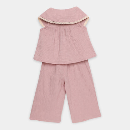 Pink checkered outfit with a top and pants on a white background