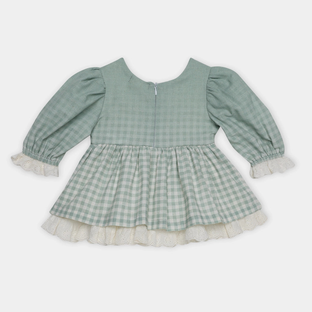 Green checkered dress with long sleeves on a white background