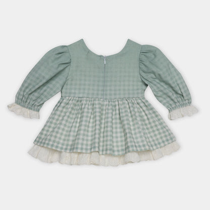 Green checkered dress with long sleeves on a white background