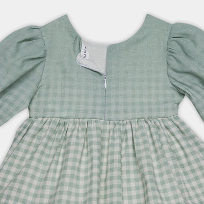 Green checkered dress with puffed sleeves on a white background