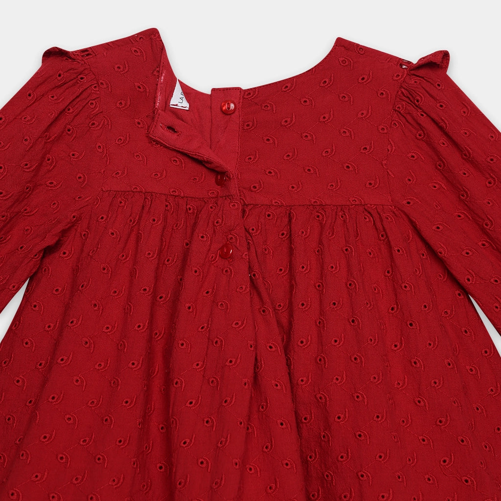 Red dress with a subtle pattern on a white background