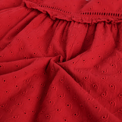 Close-up of a red fabric with a textured pattern