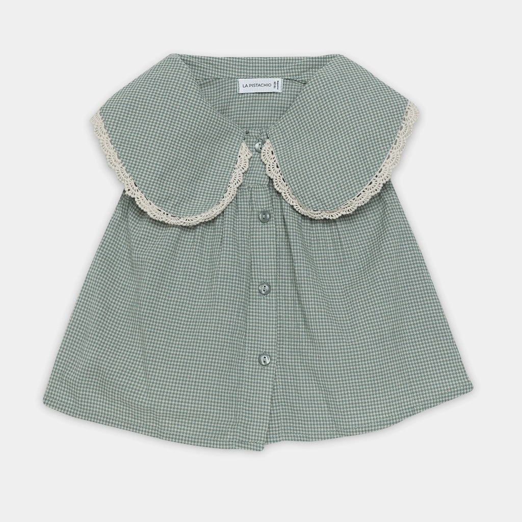 Green checkered blouse with lace collar on a white background