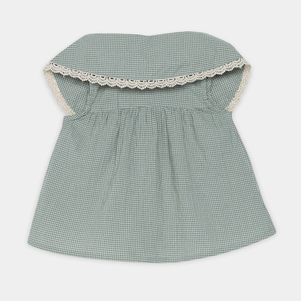 Green checkered dress with lace trim on a white background