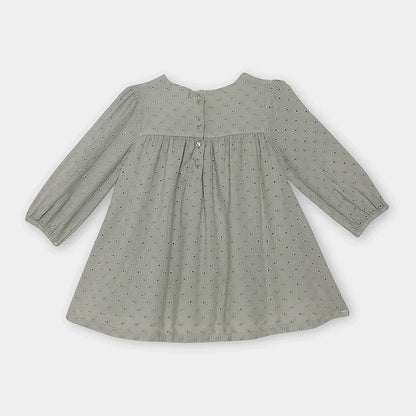 Gray dress with long sleeves on a light gray background